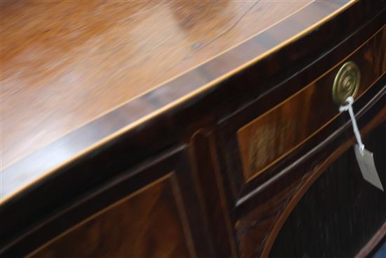 A George III crossbanded mahogany serpentine sideboard, W.6ft 1in. D.2ft 2in. H.3ft